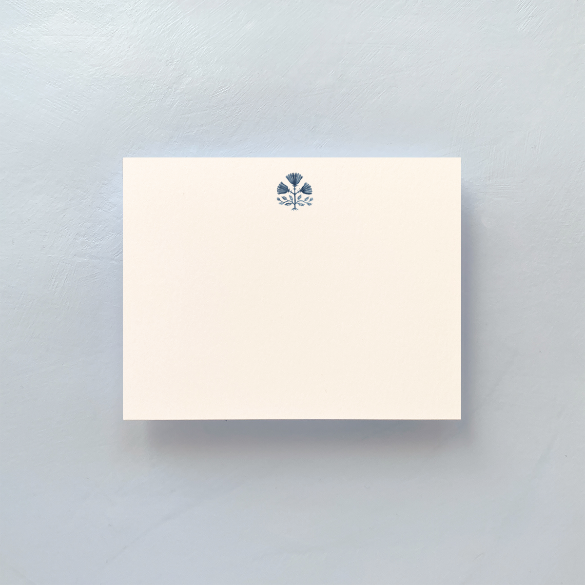 Notecard with blue and white pattern and envelope