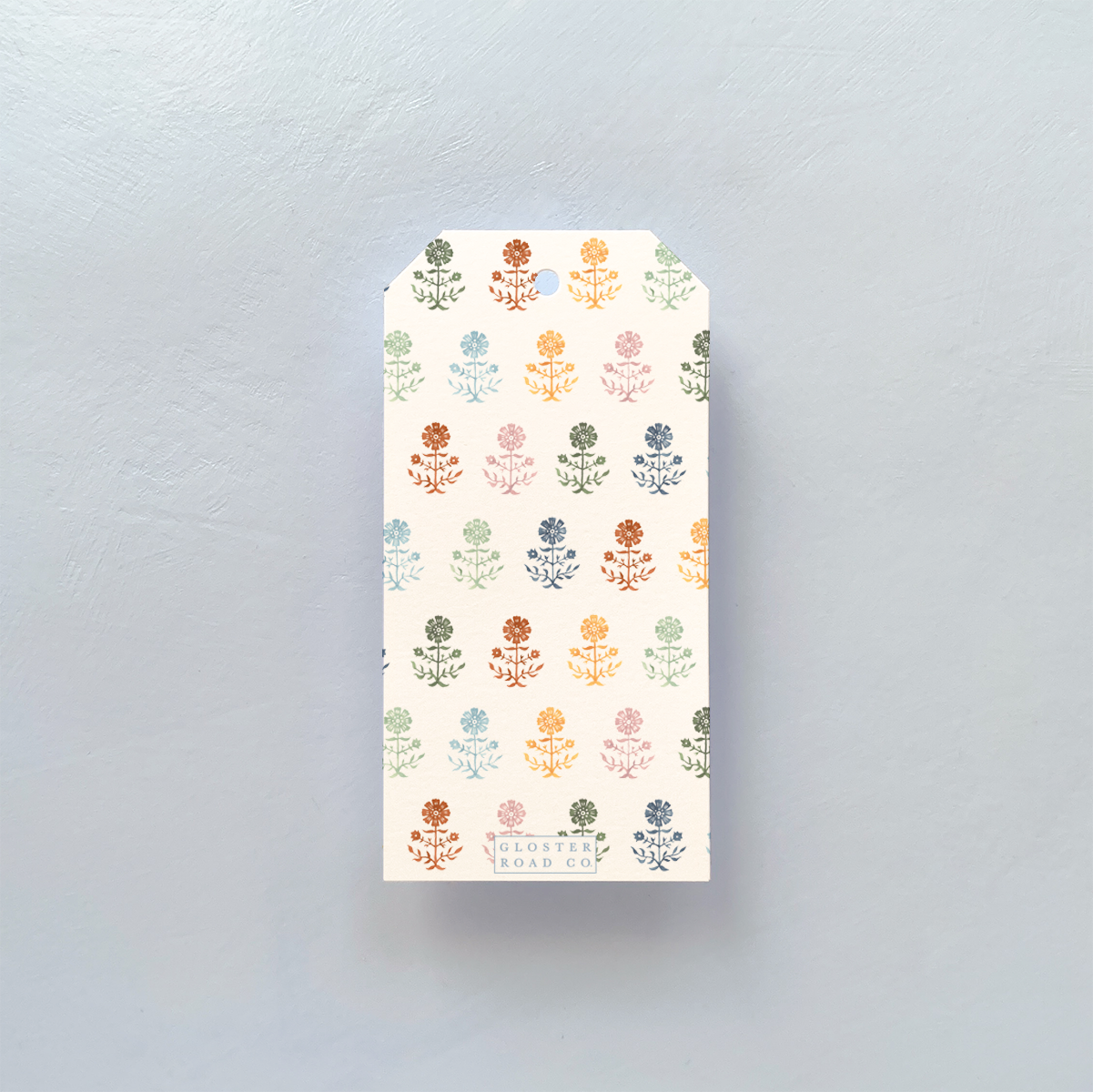 GIFT TAG WITH MULTI COLORED GERBERA PATTERN