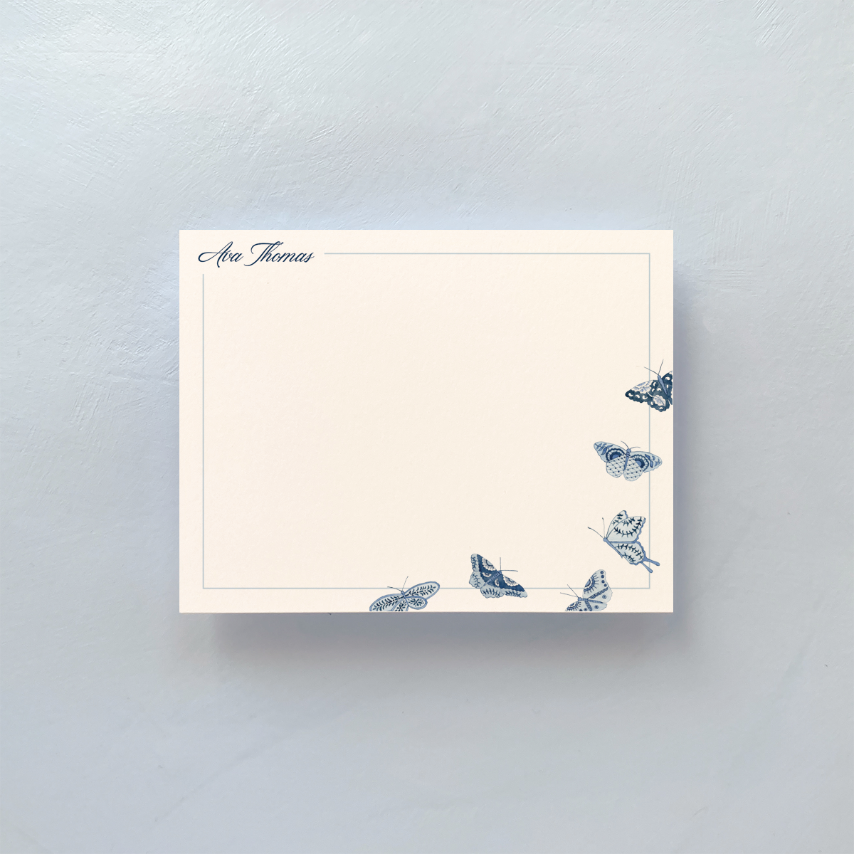 Notecard with blue and white butterfly pattern
