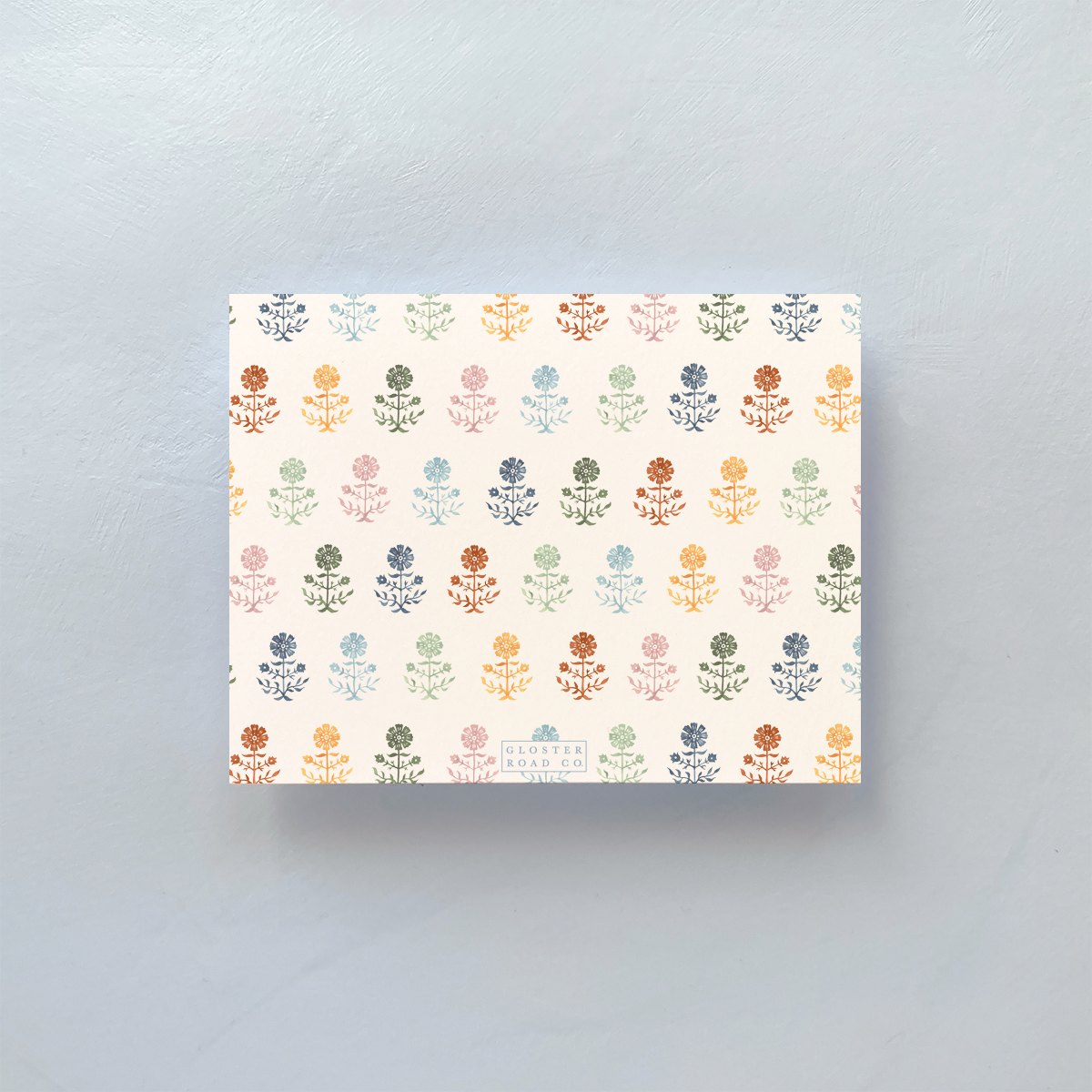 Folded notecard with Gerbera multicolored pattern and envelope