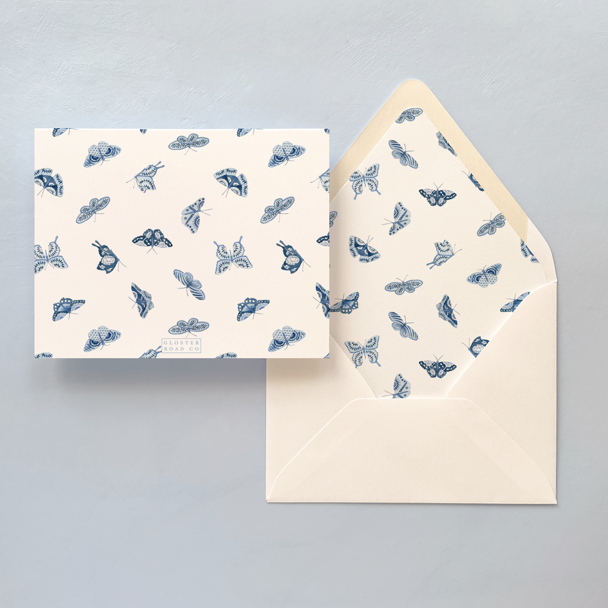 Folded notecard with blue and white butterfly pattern