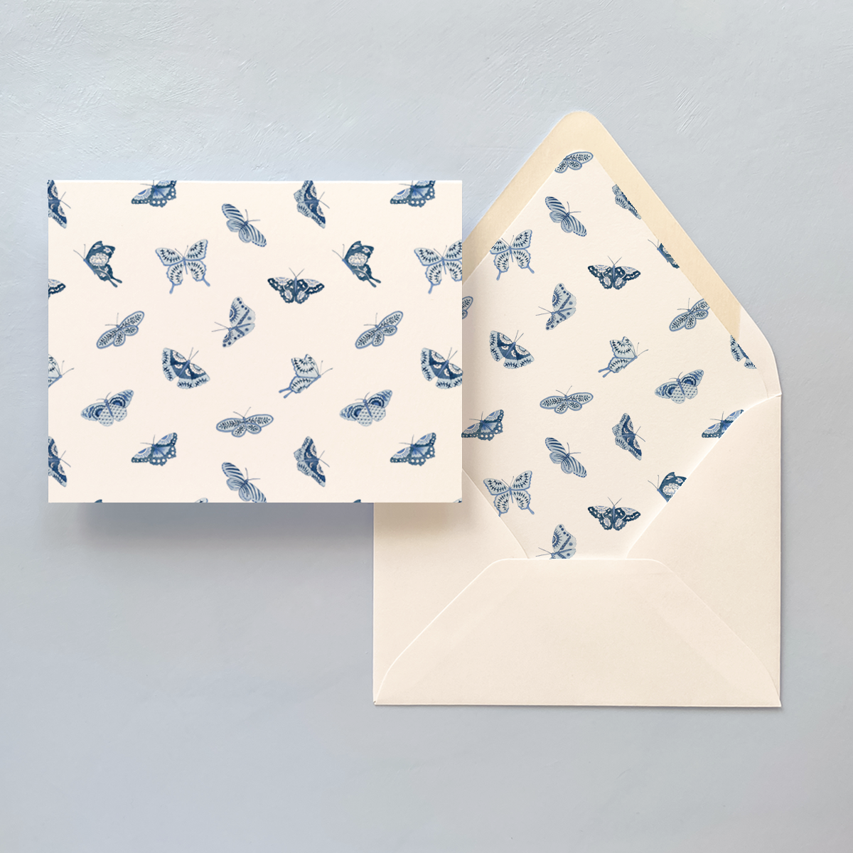 Folded notecard with blue and white butterfly pattern