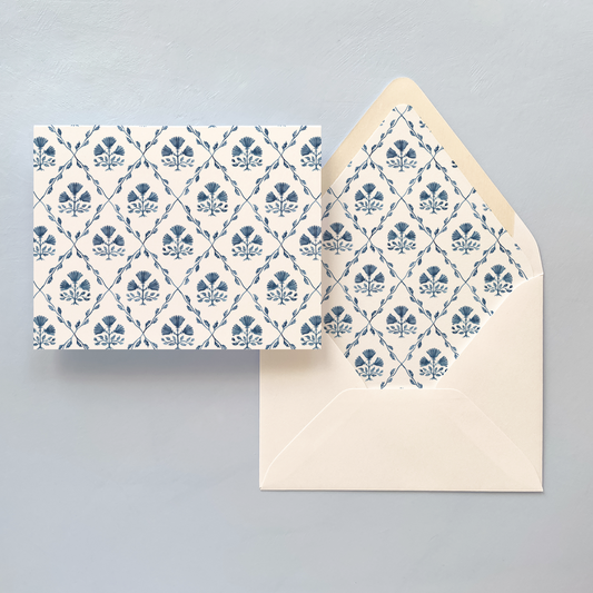 Folded notecard with blue and white pattern and envelope