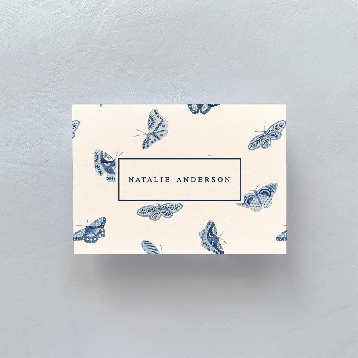 blue and white butterfly calling card