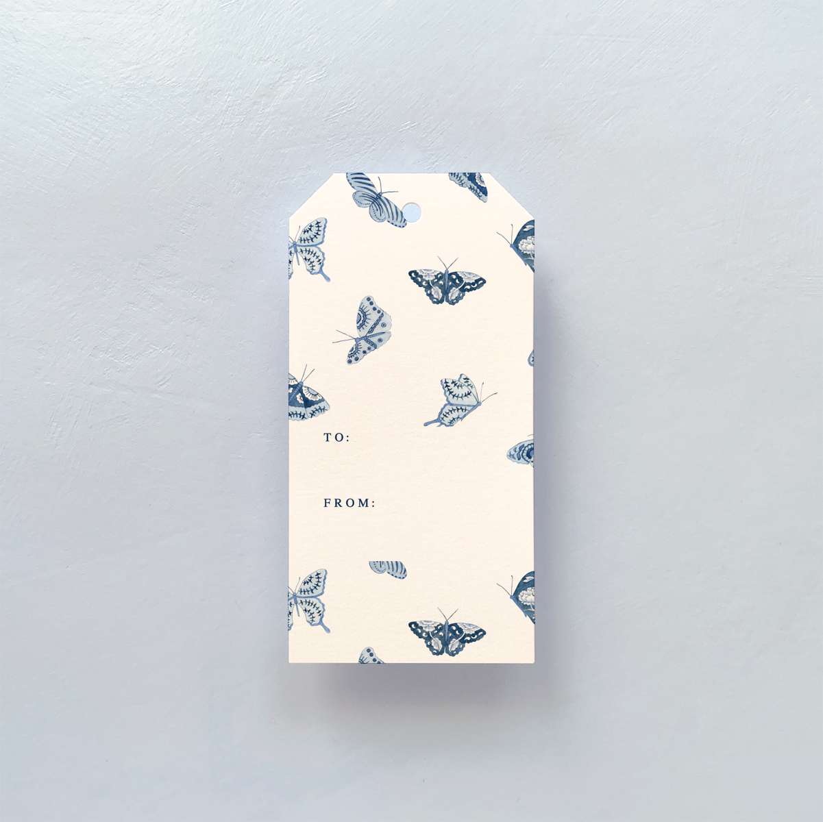 GIFT TAG WITH BLUE AND WHITE BUTTERFLY DESIGN